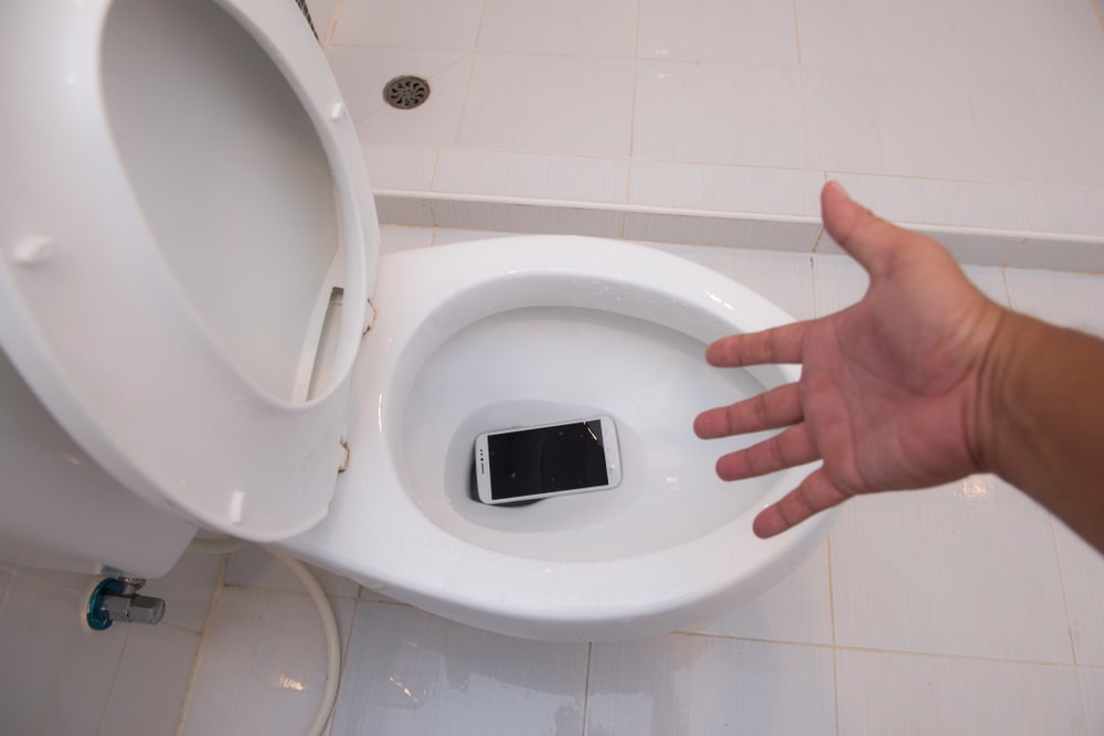 Phone drops in toilet